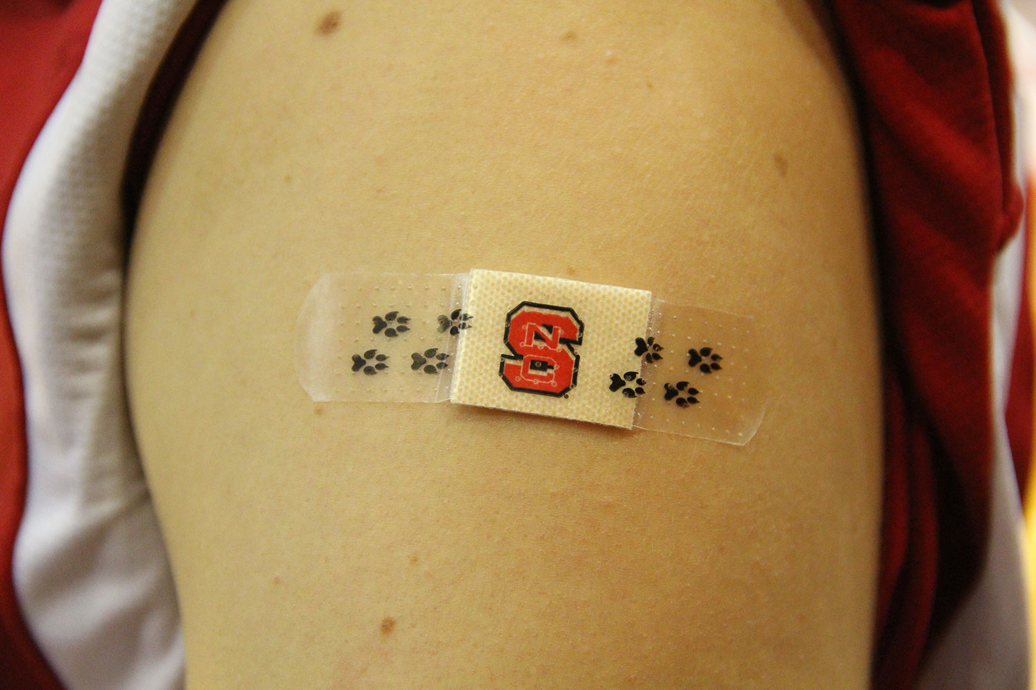 NC State bandage on arm